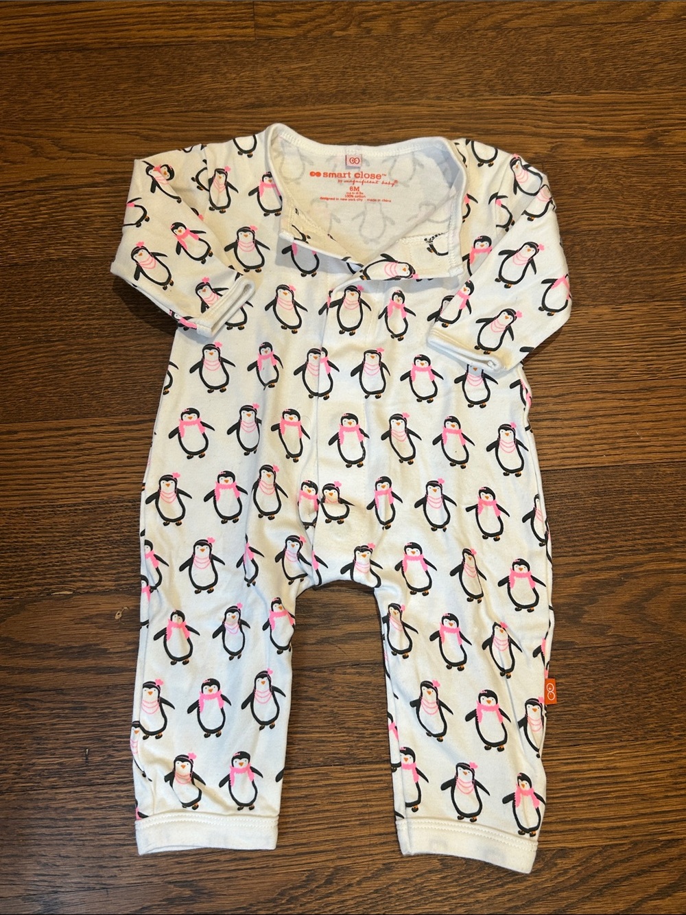 Magnificent Baby White Penguin Print One-Piece with Pink Accents